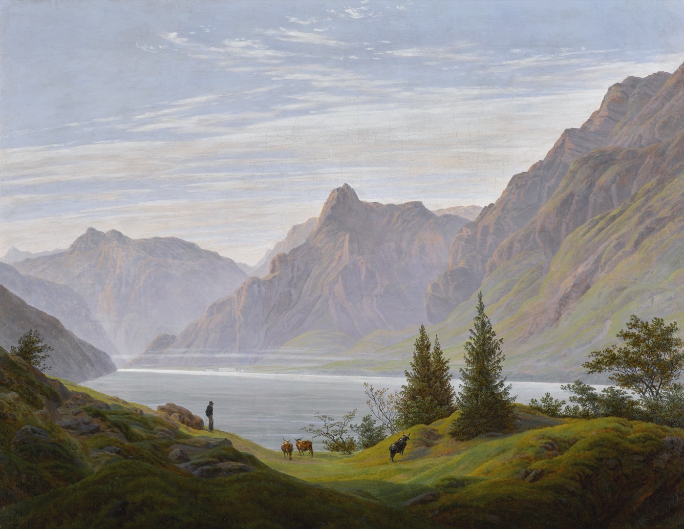 Caspar David Friedrich’s Landscape with Mountain Lake, Morning: a quiet lake beneath towering mountains, with trees and a green meadow in the foreground.